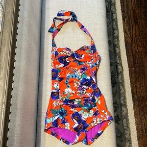 One piece bathing suit with boy shorts, padded halter top, and tummy control
